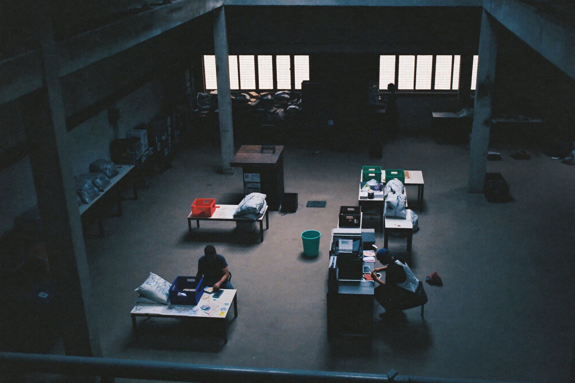 An operations lead overlooking a connected production and distribution floor